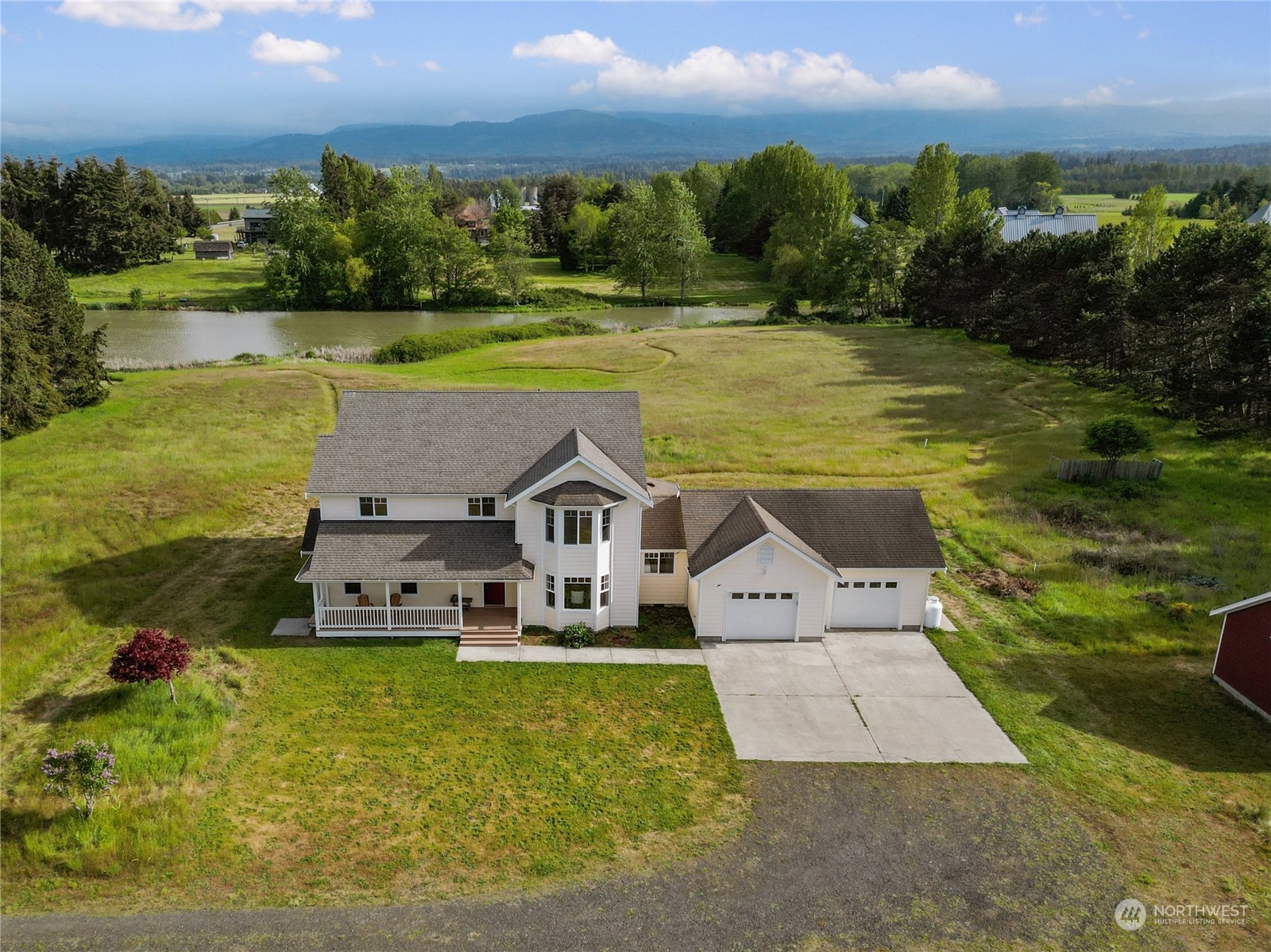 a view of a lake with a house in the background