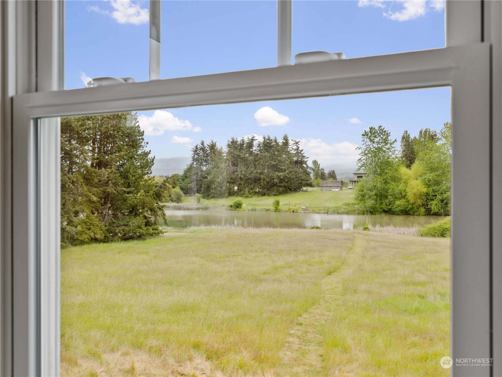 2619 Kitchen-Dick Road Sequim, WA 98382 - Photo 25 of 40 a view of a lake from a window