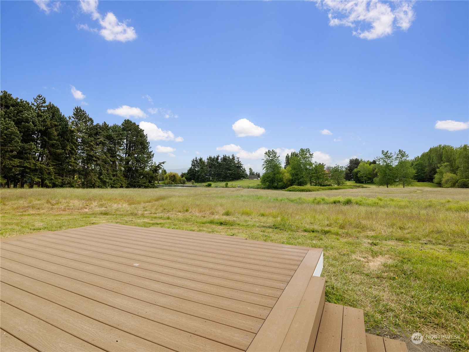 2619 Kitchen-Dick Road Sequim, WA 98382 - Photo 32 of 40 a view of a lake with a yard