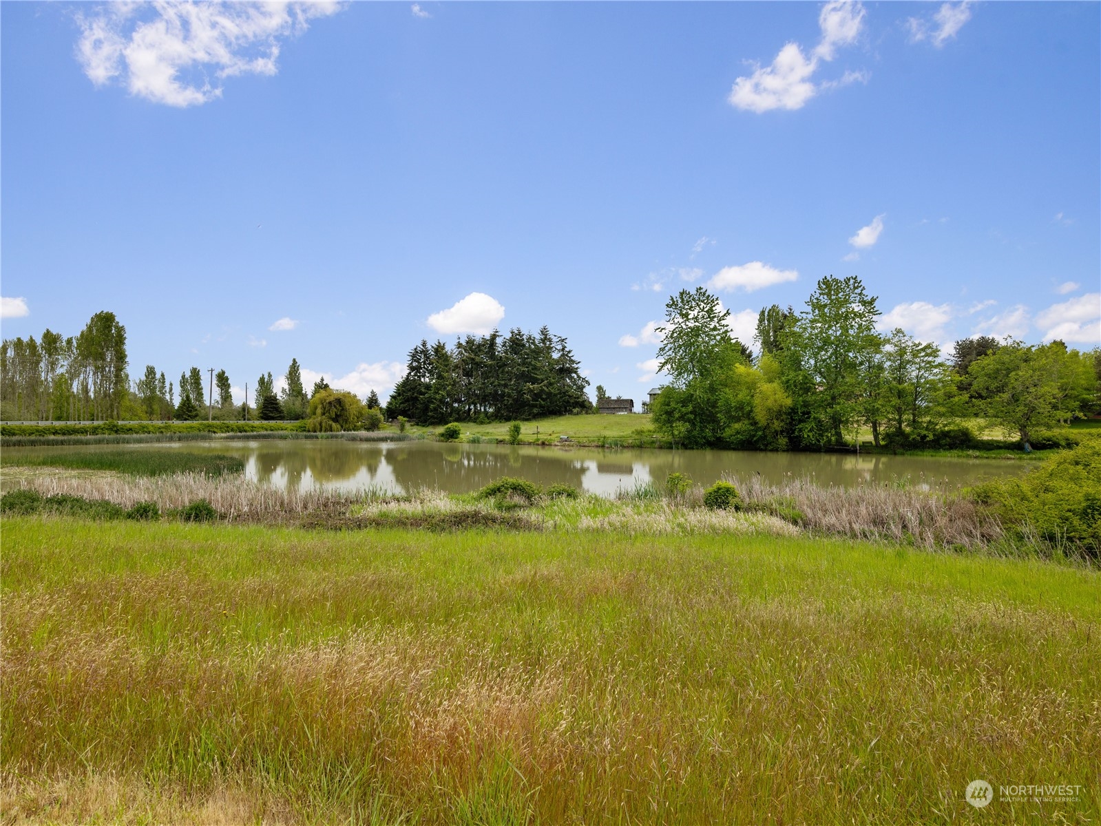 2619 Kitchen-Dick Road Sequim, WA 98382 - Photo 34 of 40 a view of a lake from a yard