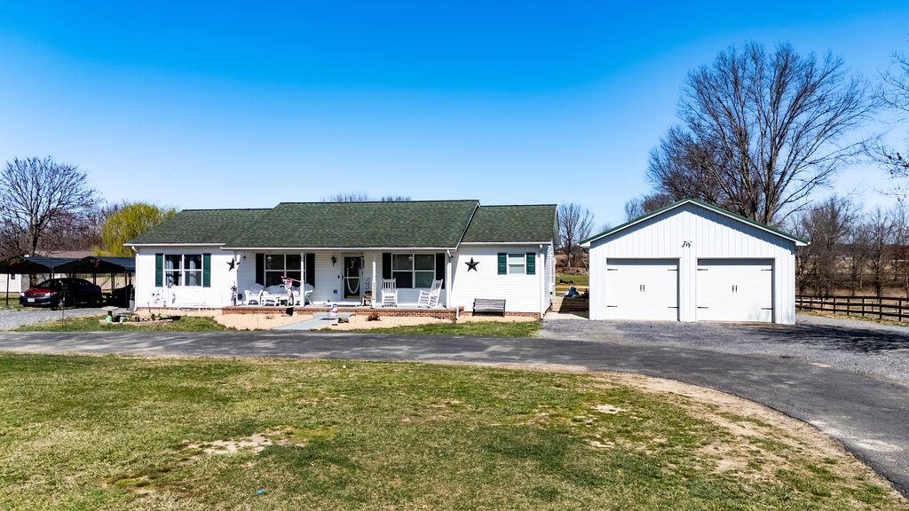 3355 Lyndhurst Road Stuarts Draft, VA 24477 - Photo 1 of 38 a front view of a house with a yard and garage