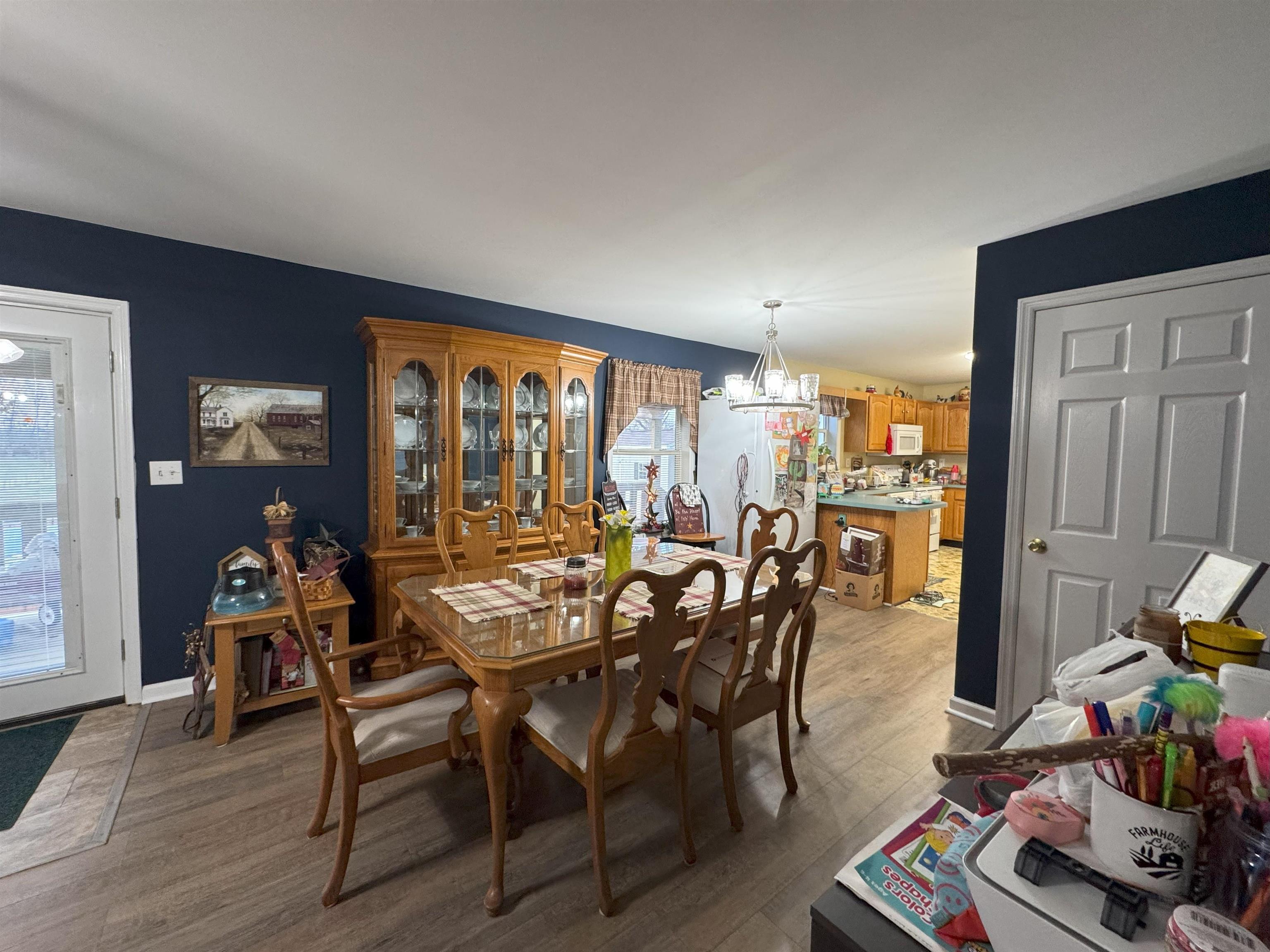 3355 Lyndhurst Road Stuarts Draft, VA 24477 - Photo 23 of 38 a view of a dining room with furniture window and wooden floor