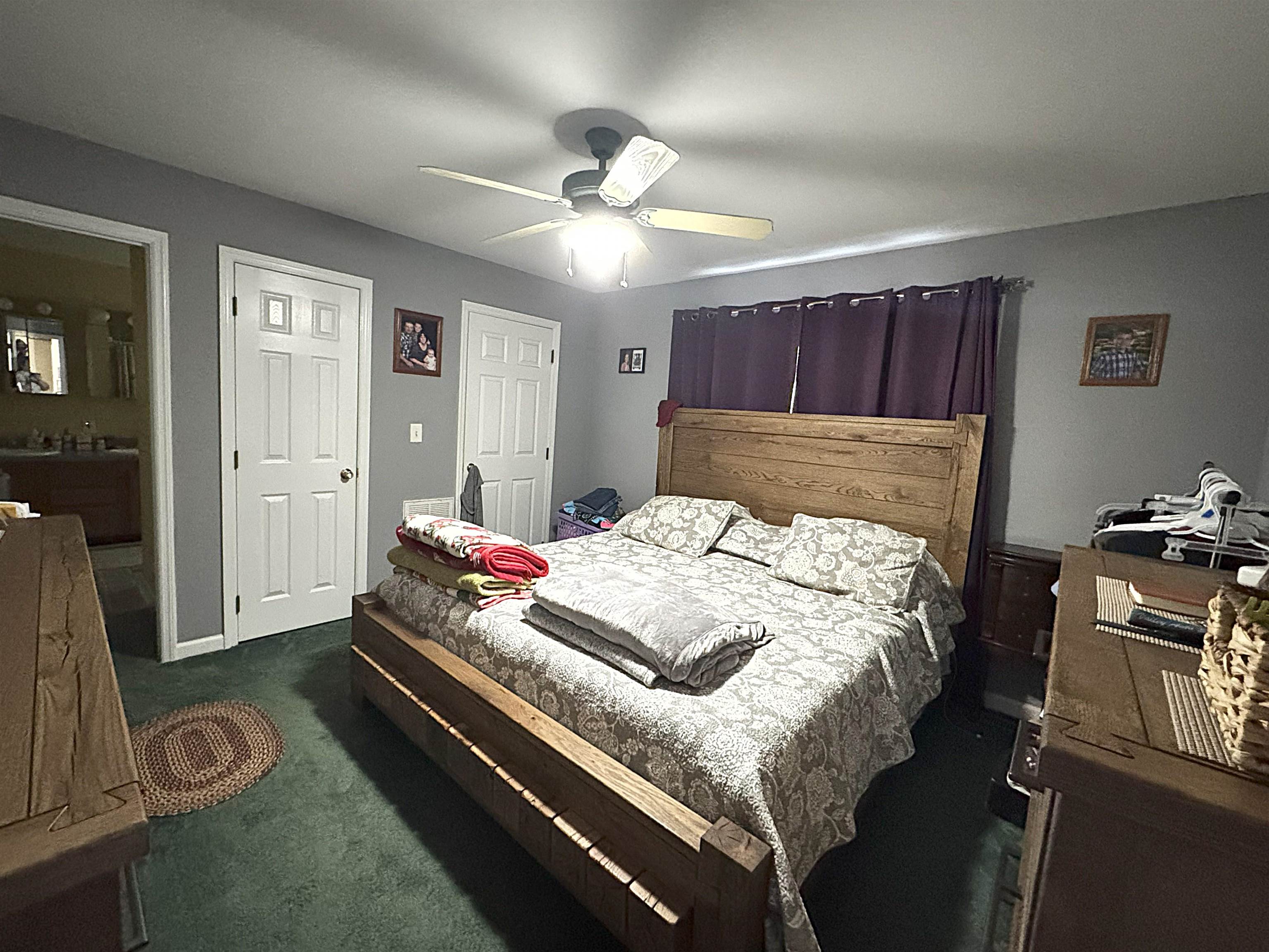 3355 Lyndhurst Road Stuarts Draft, VA 24477 - Photo 27 of 38 a bedroom with a bed and wooden floor