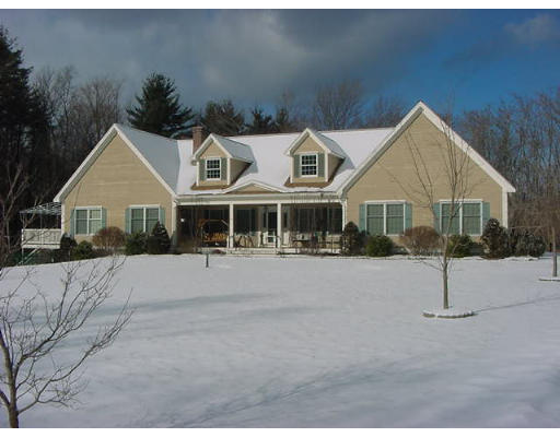 28 Hazen Road Shirley, MA 01464 - Photo 1 of 8 a front view of a house with a yard and garage