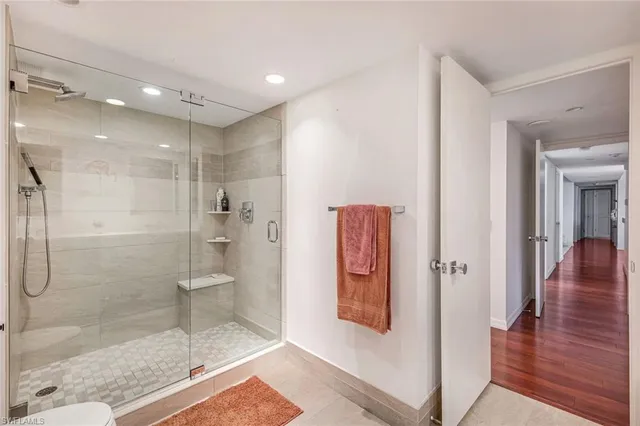 a bathroom with a glass shower door
