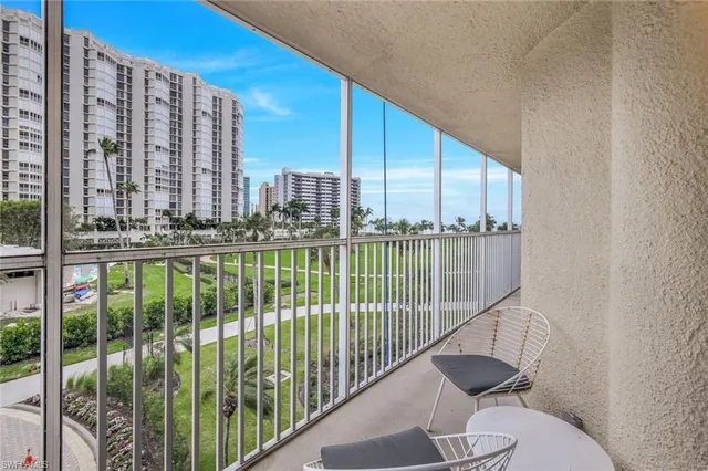 a view of a balcony with wooden floor