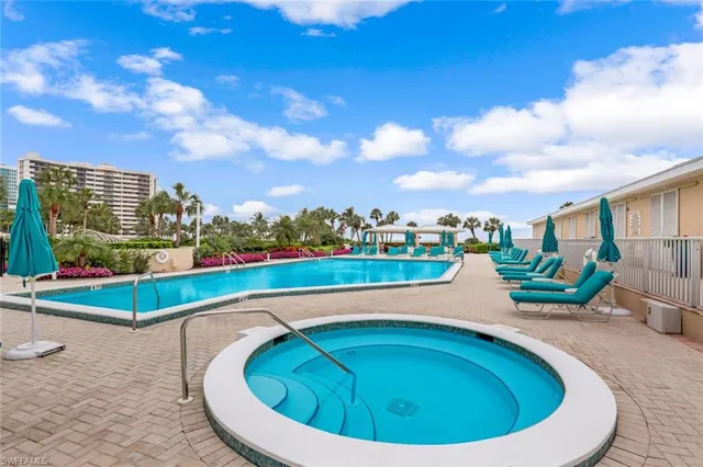 a view of a swimming pool with a terrace