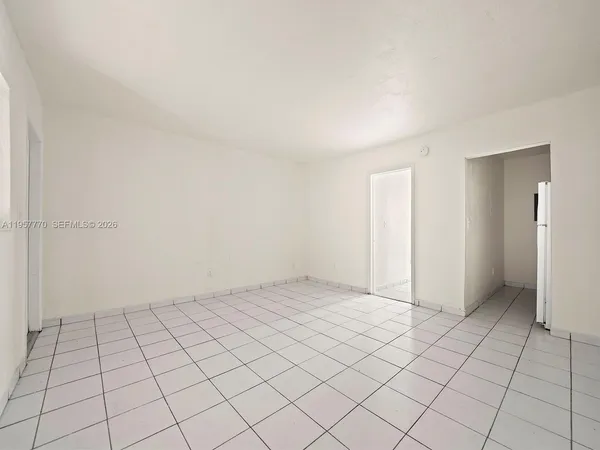 a view of an empty room and window