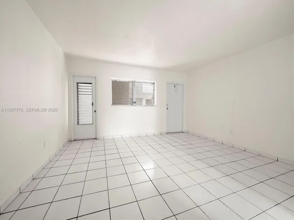 a view of an empty room and window