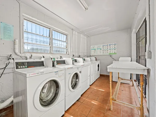 a view of a kitchen sink and stove
