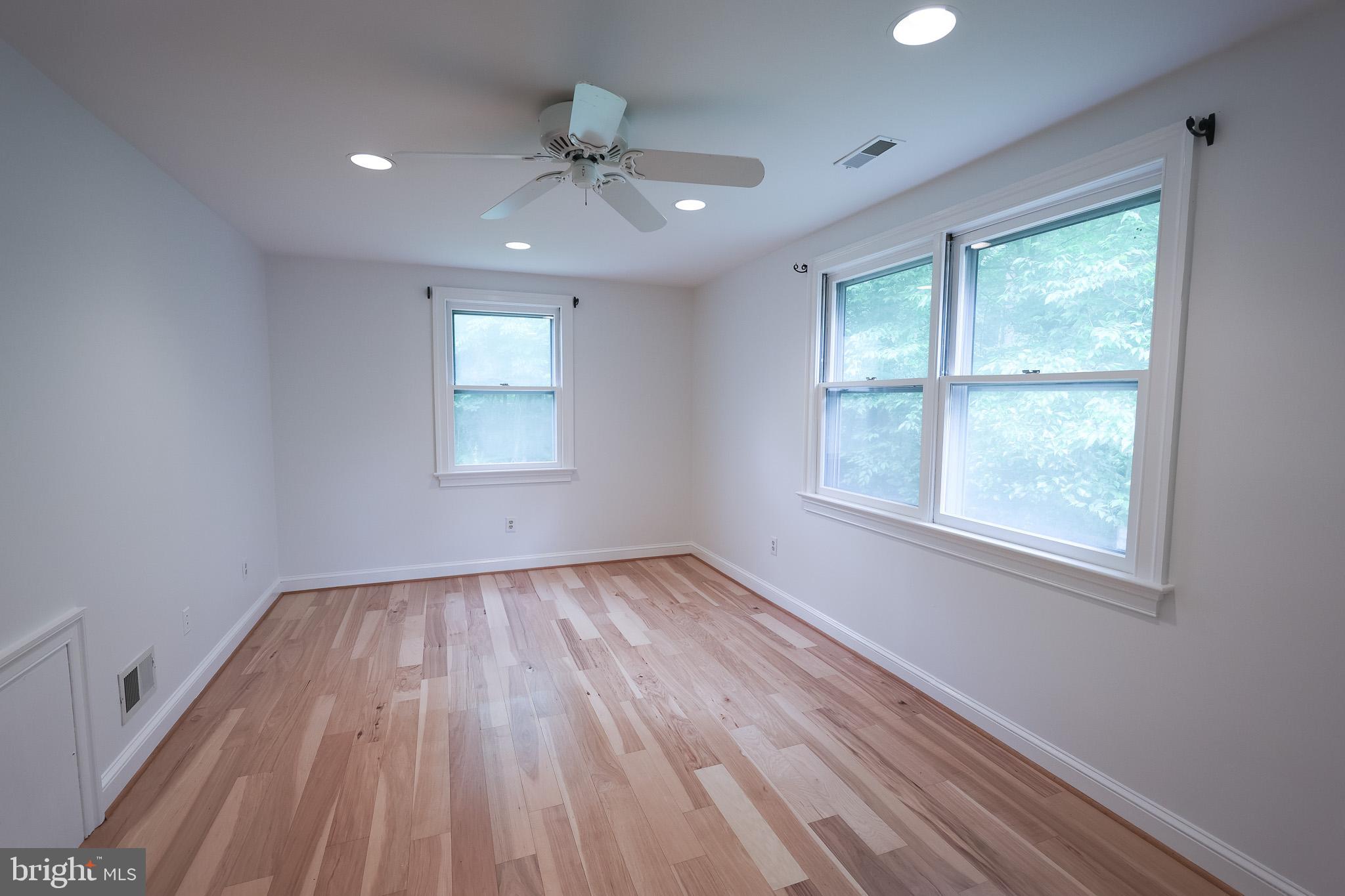 98 Swindler Hollow Road Sperryville, VA 22740 - Photo 12 of 25 wooden floor in an empty room with a window