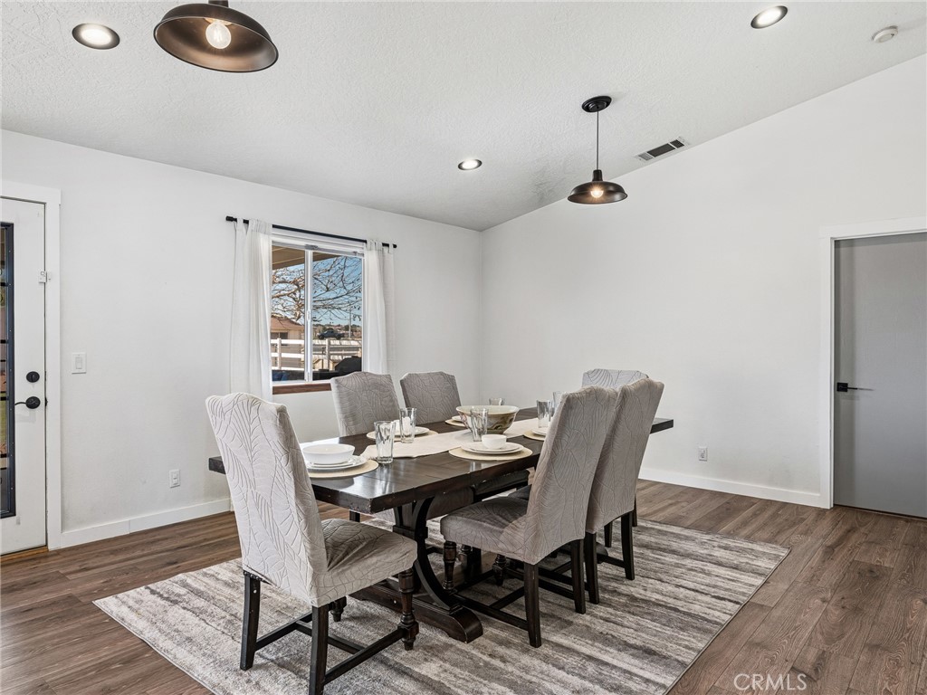 18965 Shetland Road Apple Valley, CA 92308 - Photo 14 of 45 a view of a dining room with furniture and wooden floor