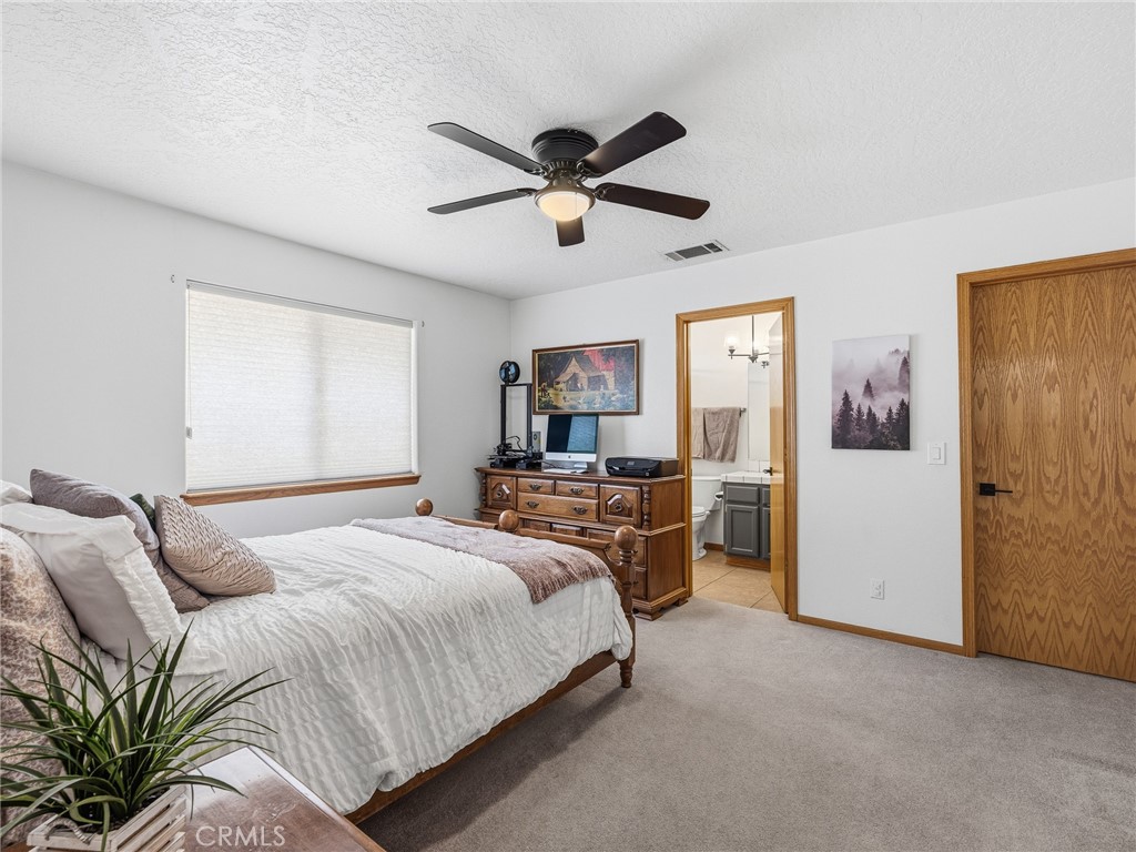 18965 Shetland Road Apple Valley, CA 92308 - Photo 16 of 45 a bedroom with a bed and window