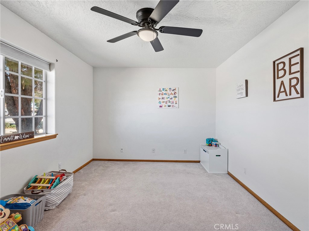 18965 Shetland Road Apple Valley, CA 92308 - Photo 23 of 45 a view of room with hardwood floor and a window