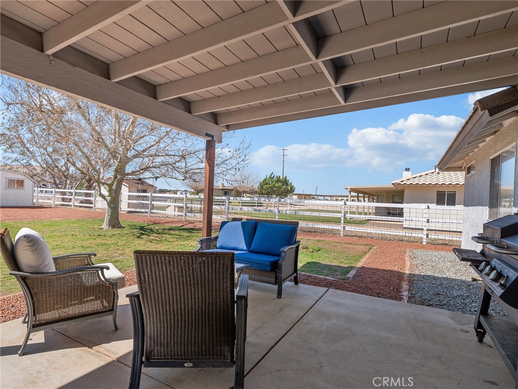 18965 Shetland Road Apple Valley, CA 92308 - Photo 34 of 45 a balcony with furniture and a view of lake