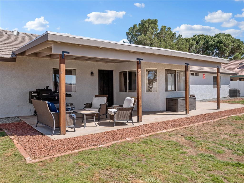 18965 Shetland Road Apple Valley, CA 92308 - Photo 40 of 45 a view of a patio with a table and chairs