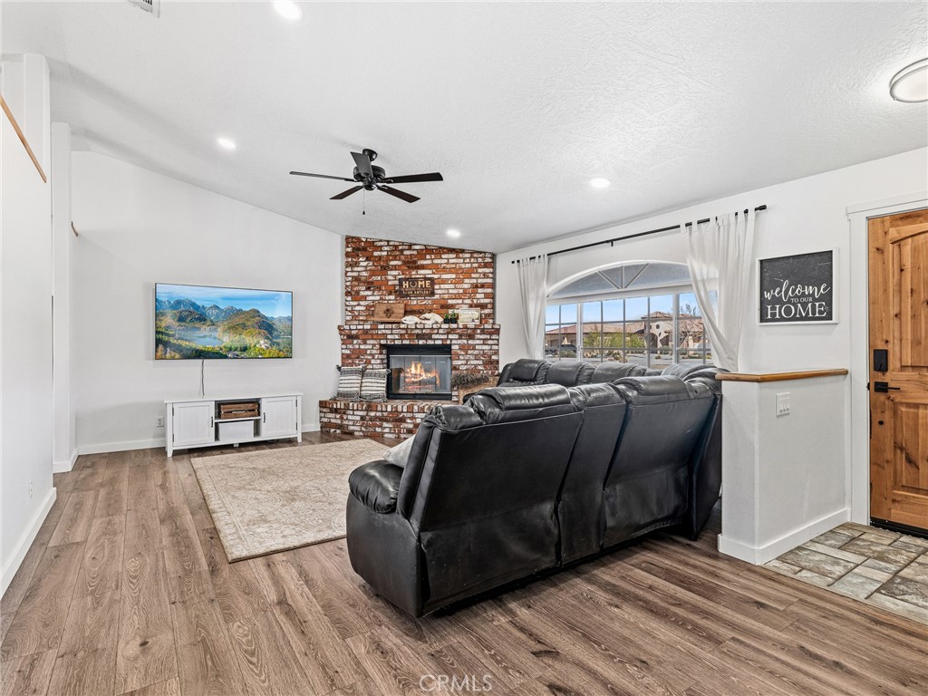 18965 Shetland Road Apple Valley, CA 92308 - Photo 4 of 45 a living room with furniture and a wooden floor
