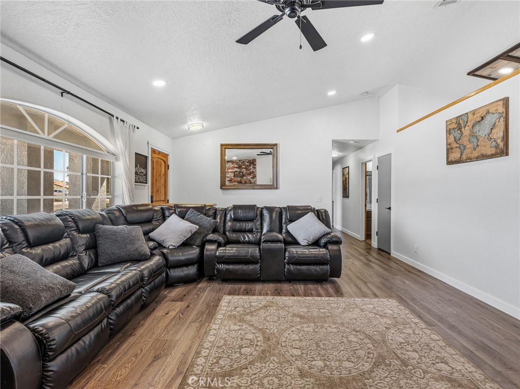 18965 Shetland Road Apple Valley, CA 92308 - Photo 5 of 45 a living room with furniture and a large window
