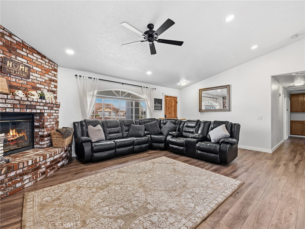 18965 Shetland Road Apple Valley, CA 92308 - Photo 6 of 45 a living room with furniture and a fireplace