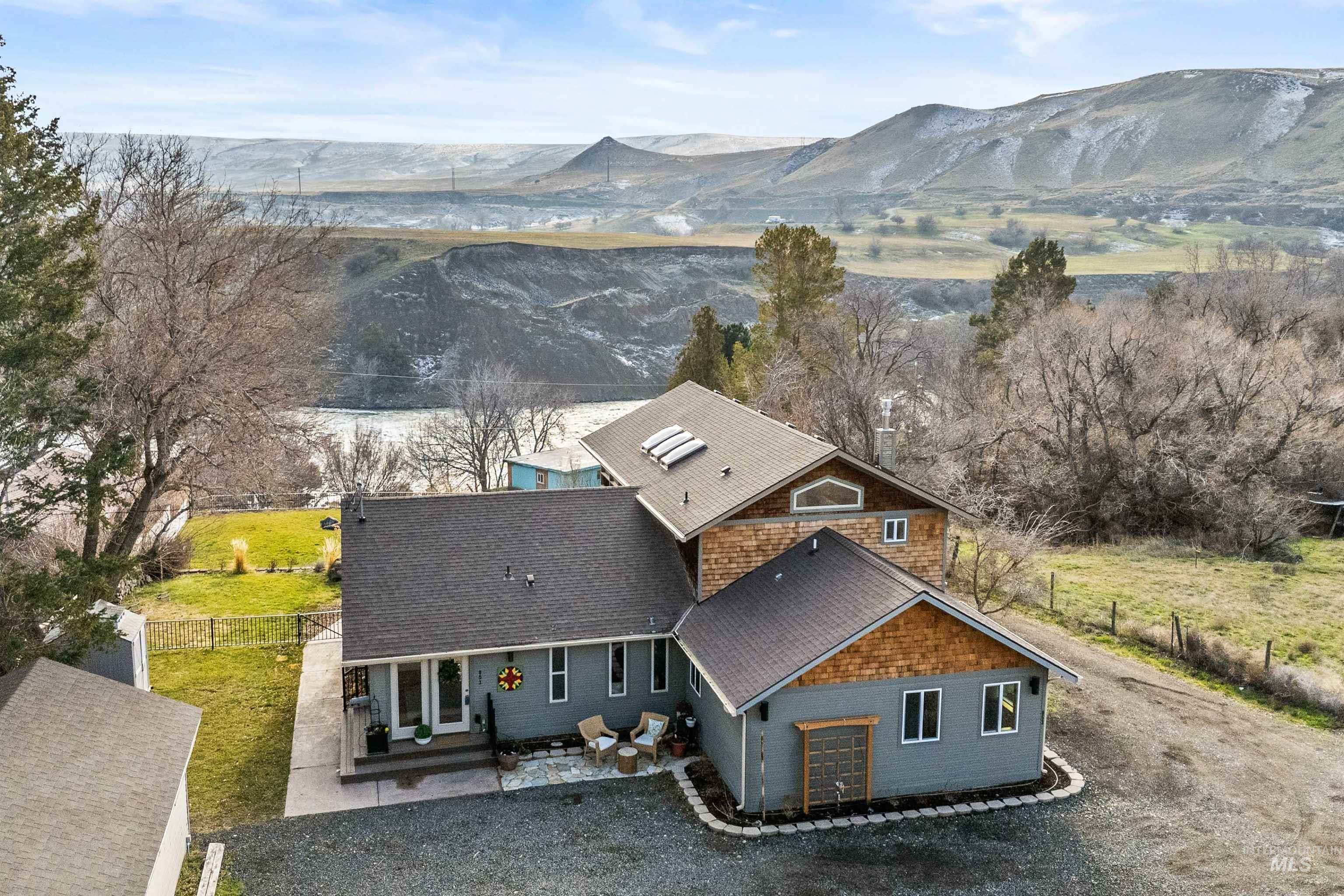 853 Pottery Road Bliss, ID 83314 - Photo 4 of 50 Aerial view of property and surrounding area with a mountain backdrop