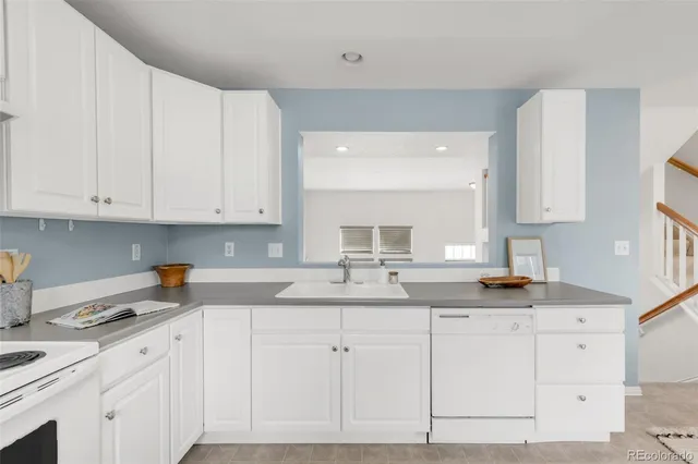 a bathroom with a sink vanity and mirror