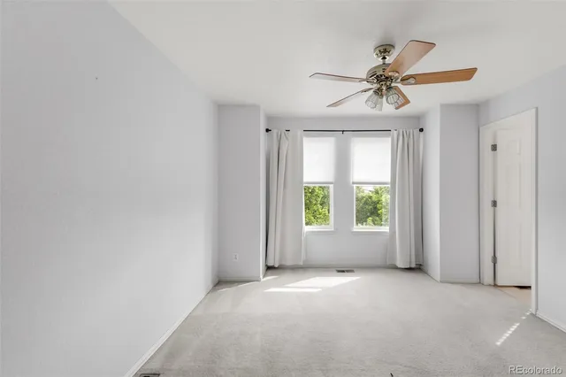a view of a storage and utility room with washer and dryer