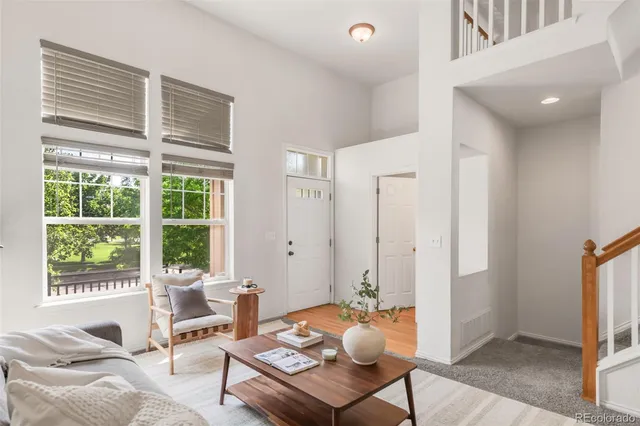 a living room with furniture and a table