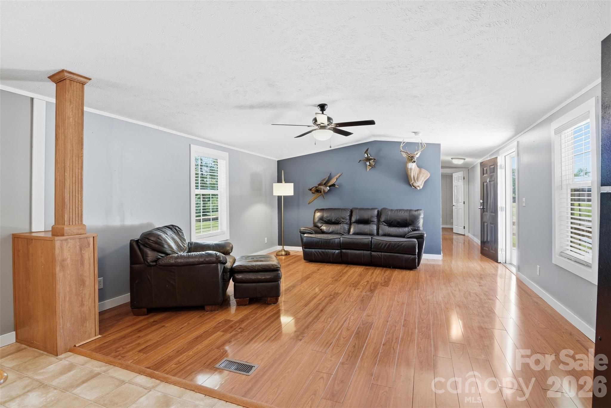 4406 Lucy Short Cut Road Marshville, NC 28103 - Photo 11 of 30 a living room with furniture and a chandelier