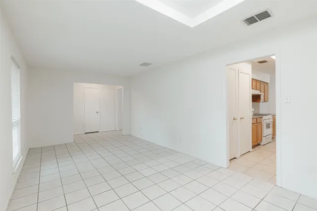 a kitchen with stainless steel appliances granite countertop a stove a sink dishwasher and a refrigerator