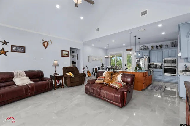 a kitchen with refrigerator and cabinets