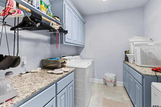 a bathroom with a granite countertop sink a toilet and shower