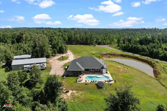 an aerial view of a house with garden space and street view