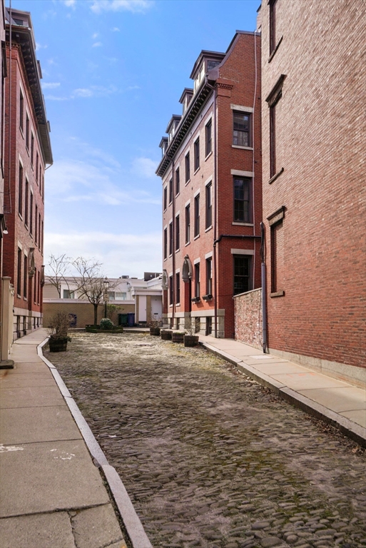 3 Harvard Place, Unit 1 Boston, MA 02129 - Photo 14 of 15 a view of a building with many windows