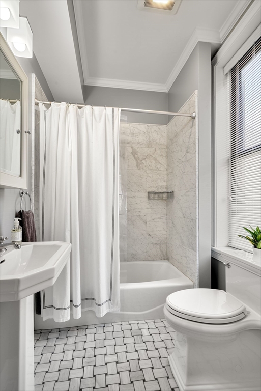 3 Harvard Place, Unit 1 Boston, MA 02129 - Photo 7 of 15 a bathroom with a sink a toilet and shower