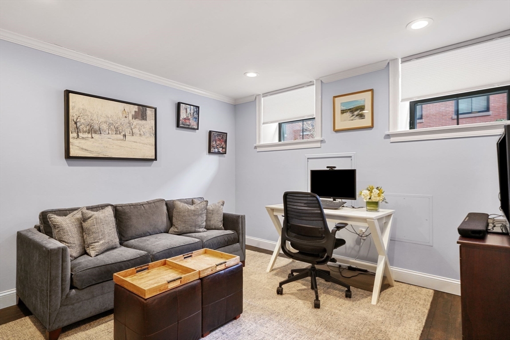 3 Harvard Place, Unit 1 Boston, MA 02129 - Photo 8 of 15 a view of a livingroom with workspace and a couch
