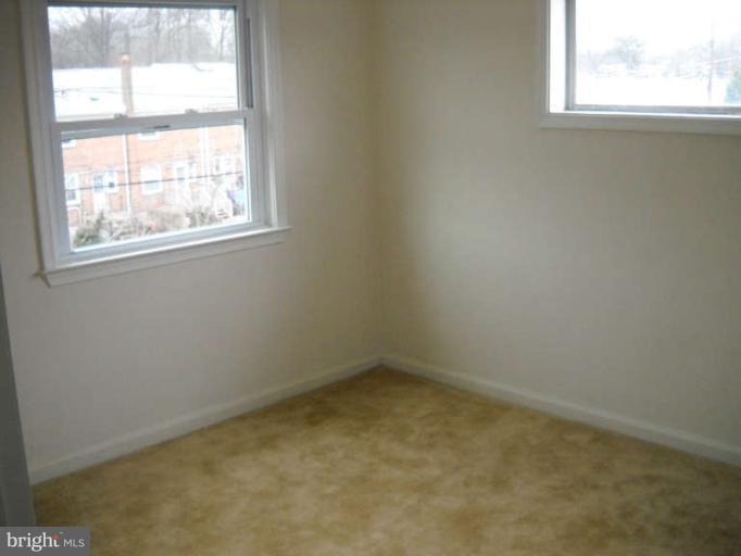 4412 Fenor Road Halethorpe, MD 21227 - Photo 6 of 8 an empty room with a window