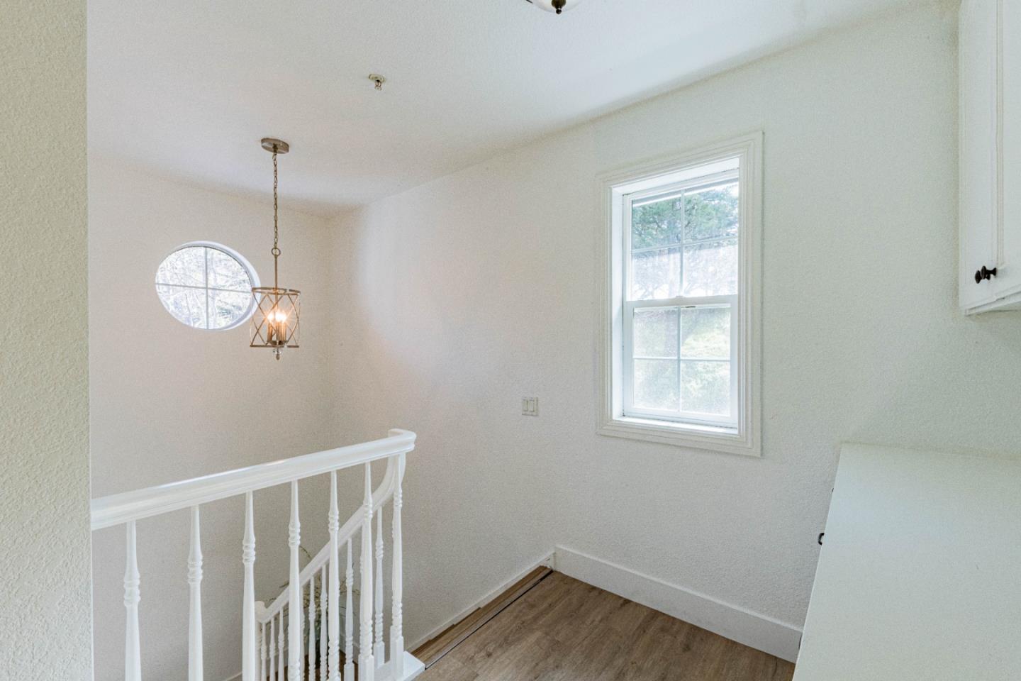 18 Hancock Circle Salinas, CA 93906 - Photo 20 of 36 a view of a room with wooden floor and windows