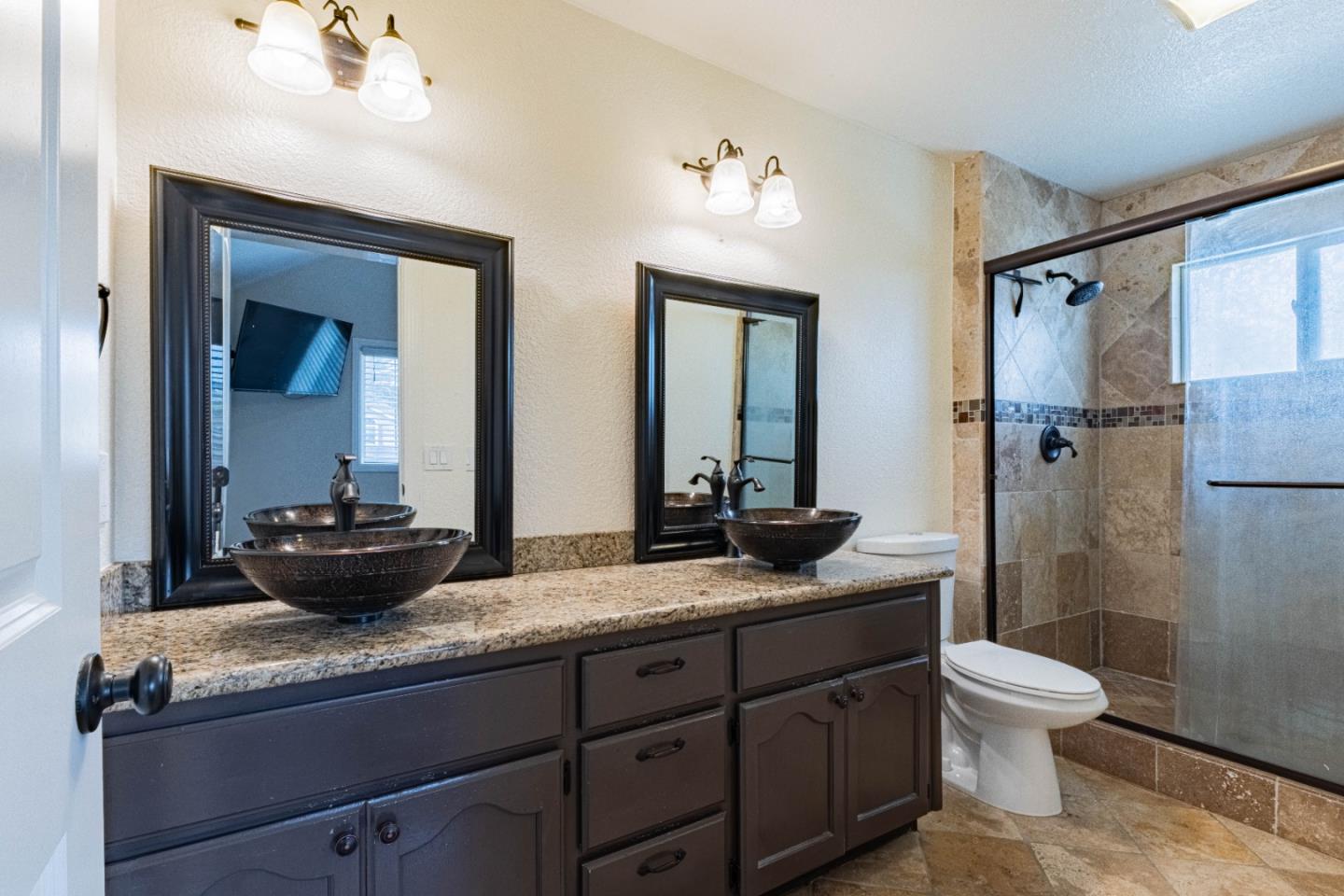 18 Hancock Circle Salinas, CA 93906 - Photo 24 of 36 a bathroom with a granite countertop sink a toilet and shower