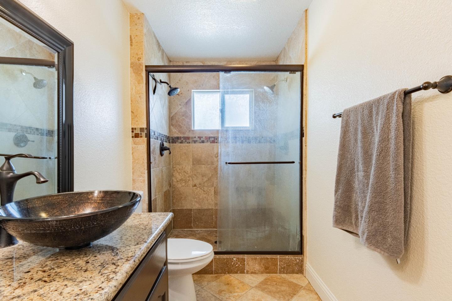 18 Hancock Circle Salinas, CA 93906 - Photo 25 of 36 a bathroom with a granite countertop sink toilet and shower