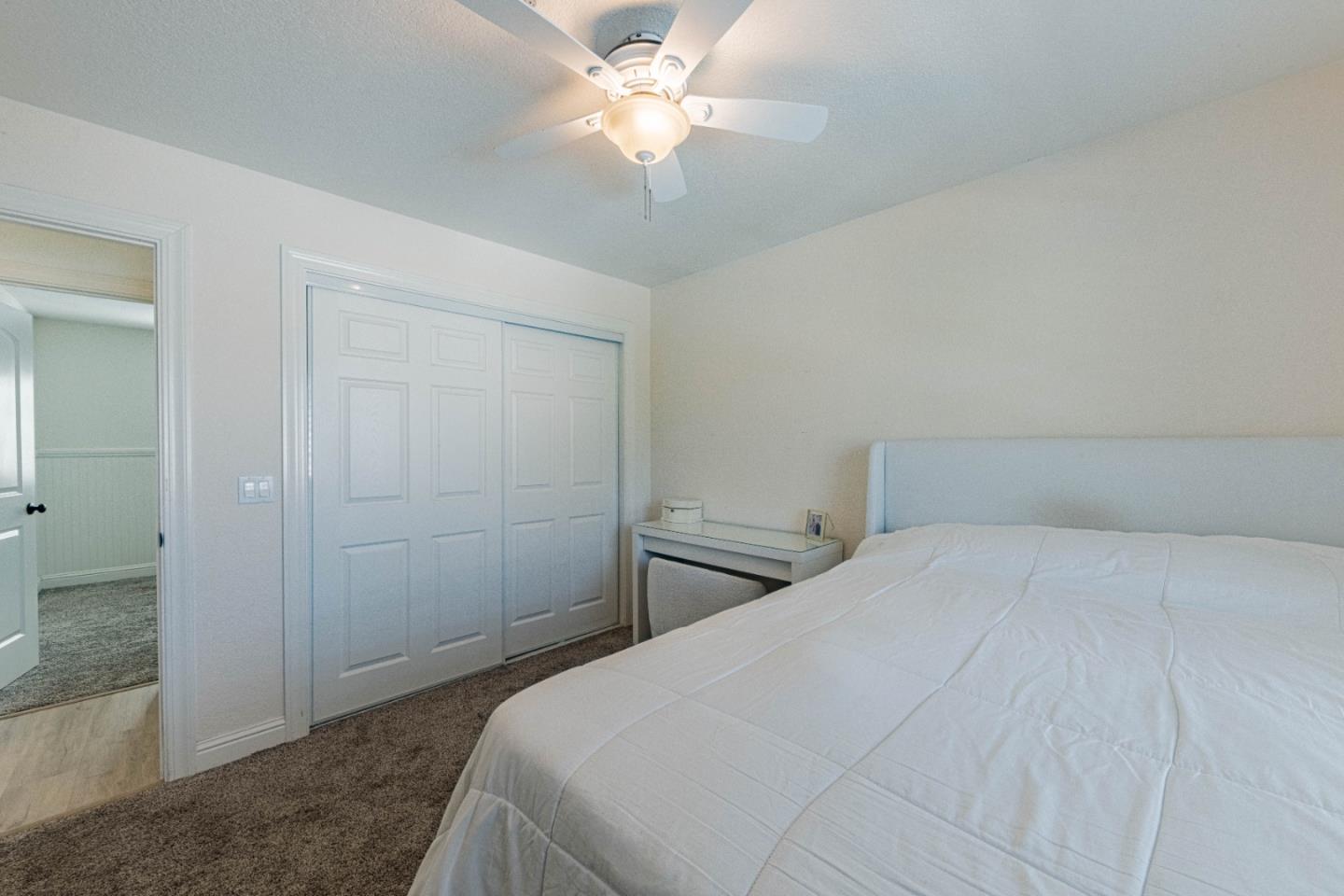 18 Hancock Circle Salinas, CA 93906 - Photo 27 of 36 a bedroom with a bed and a chandelier