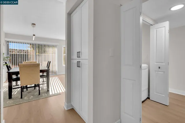 a view of a room with dining room and wooden floor
