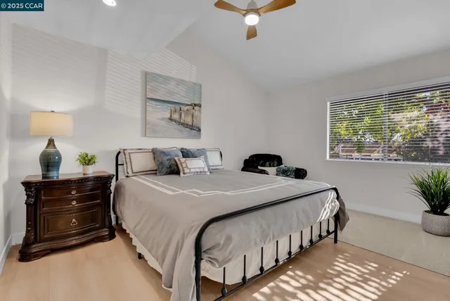 a bedroom with bed and a window