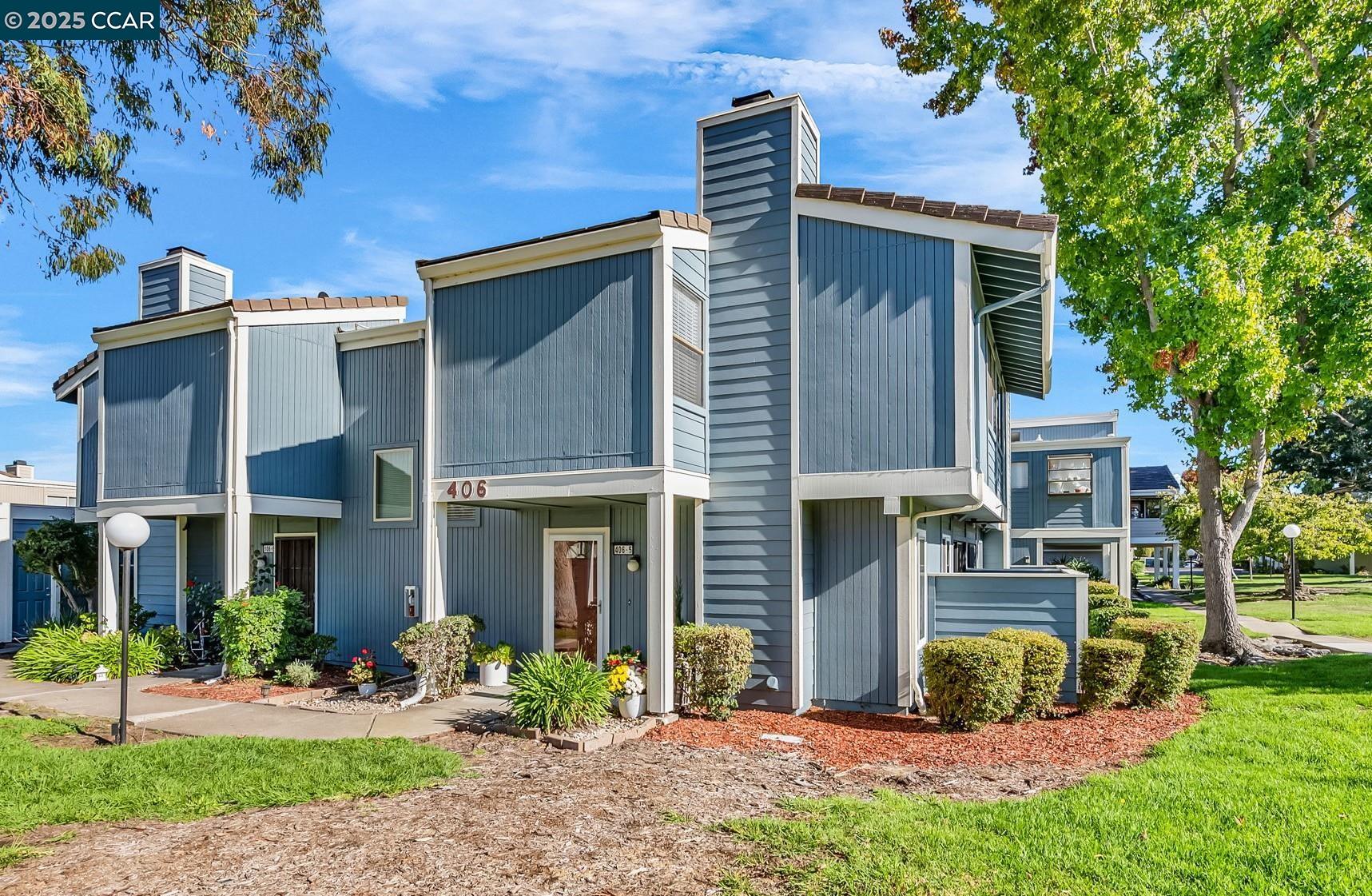 406 Olympus, Unit 5 Hercules, CA 94547 - Photo 2 of 49 front view of a house with a yard