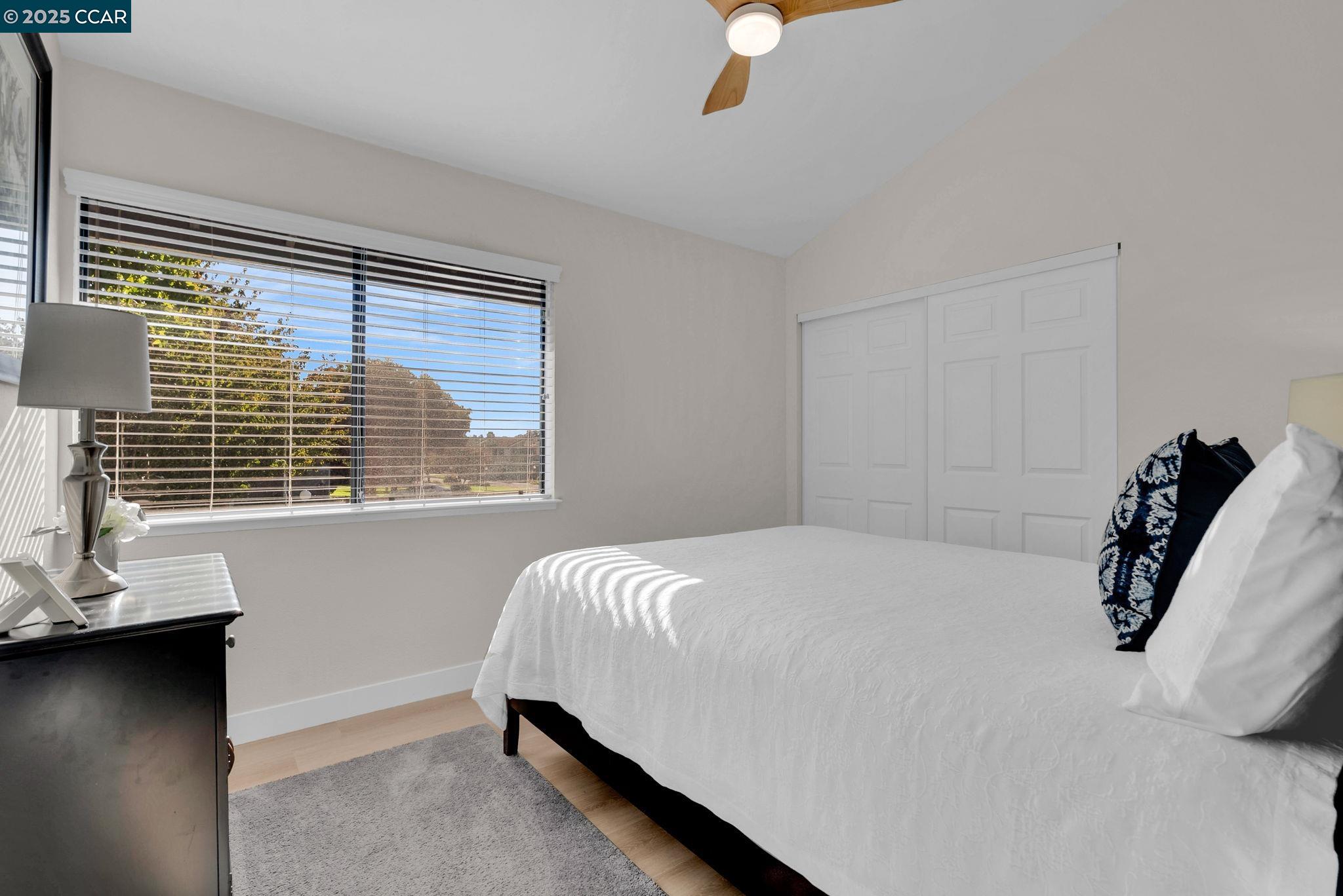 406 Olympus, Unit 5 Hercules, CA 94547 - Photo 27 of 49 a bedroom with a bed and a window