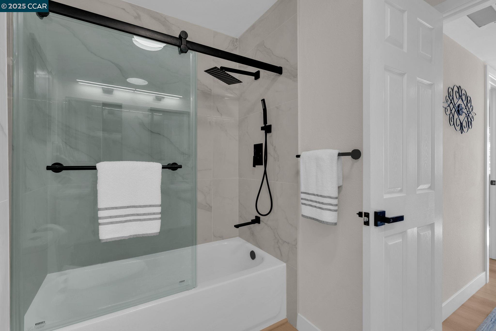 406 Olympus, Unit 5 Hercules, CA 94547 - Photo 31 of 49 a bathroom with a bath tub