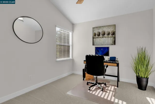 a view of a livingroom with furniture and a potted plant