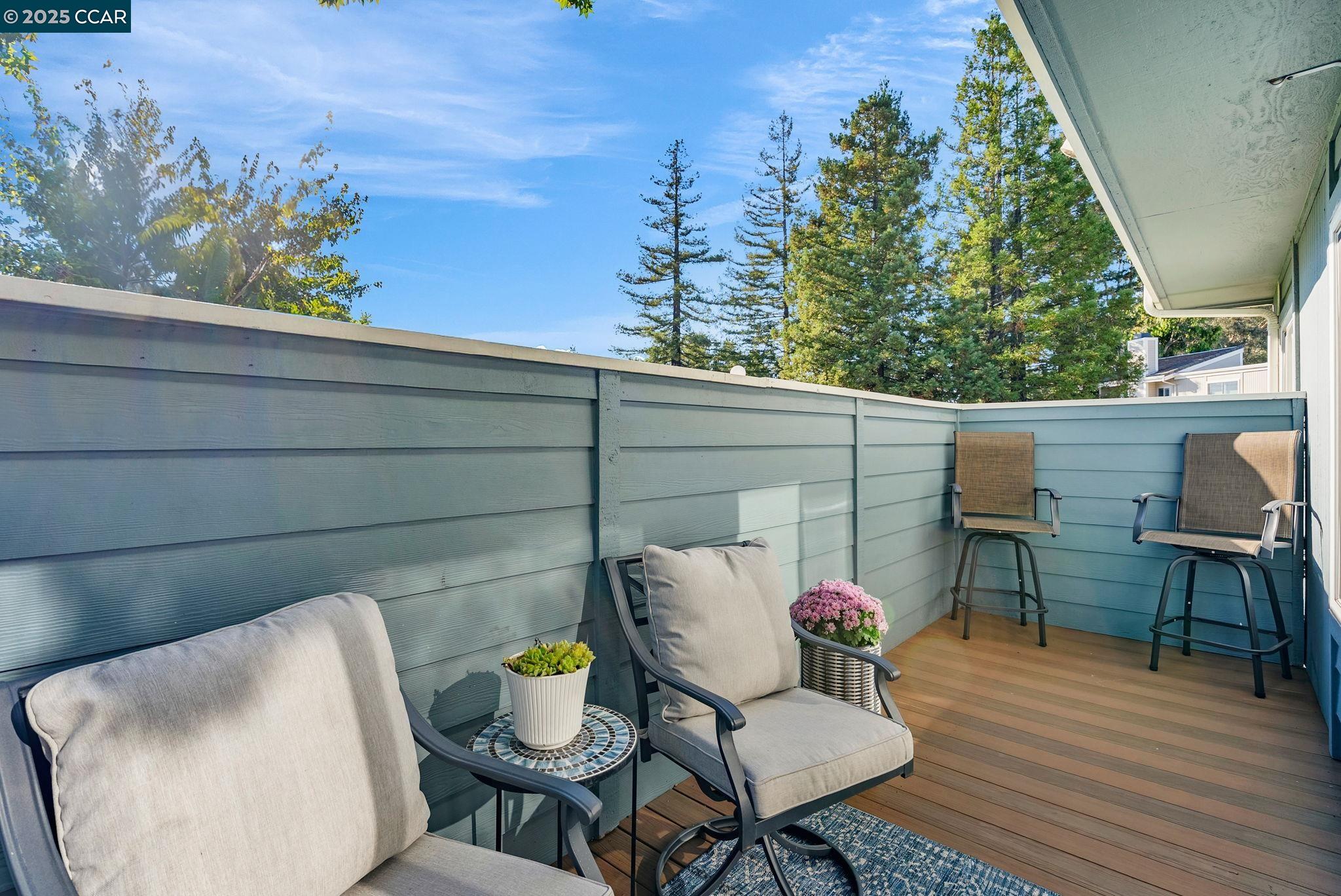 406 Olympus, Unit 5 Hercules, CA 94547 - Photo 34 of 49 a view of a chairs and table in patio