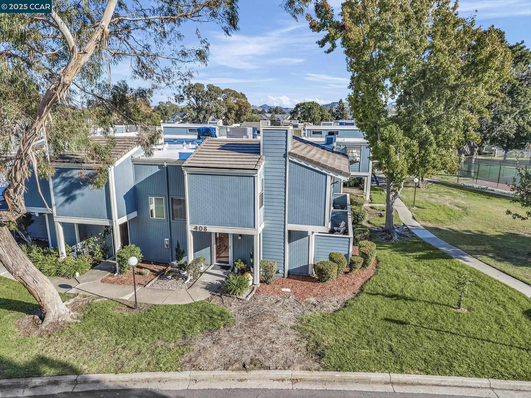 406 Olympus, Unit 5 Hercules, CA 94547 - Photo 40 of 49 a view of a house with a yard