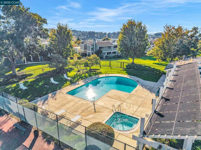 a view of a swimming pool with a lounge chairs
