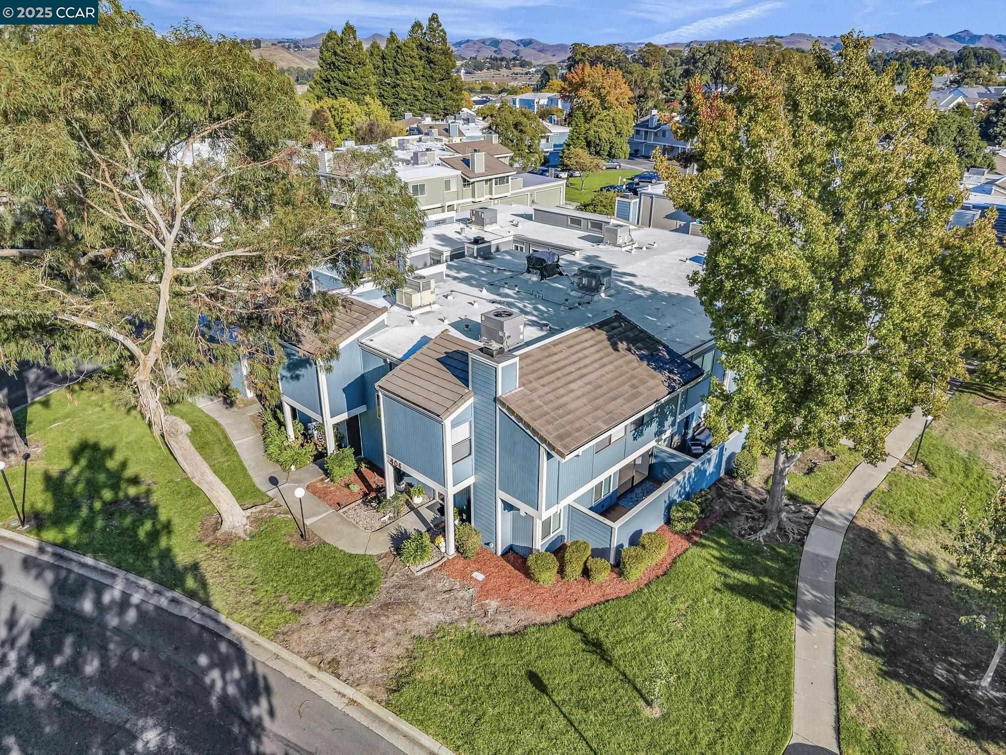 406 Olympus, Unit 5 Hercules, CA 94547 - Photo 45 of 49 an aerial view of residential houses with outdoor space and trees